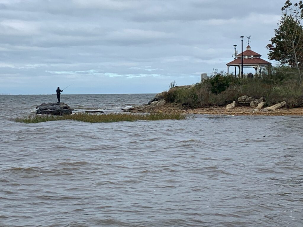 a person fishing on a small island (MyCoast AI)