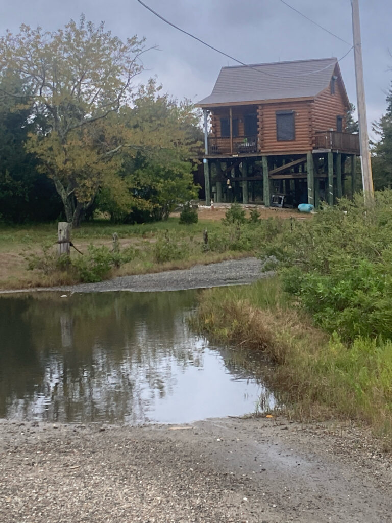 a house with a pond in front of it (MyCoast AI)