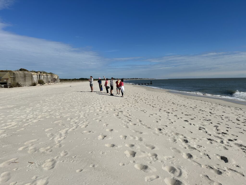 a group of people walking on a beach (MyCoast AI)