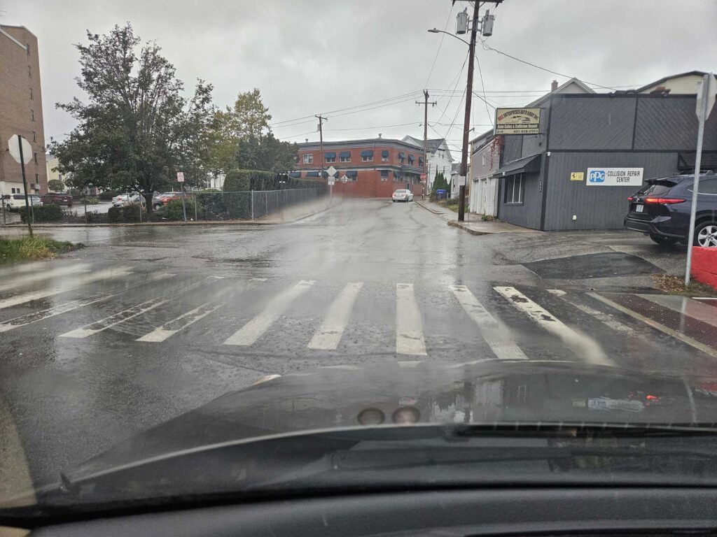a street with cars and buildings (MyCoast AI)