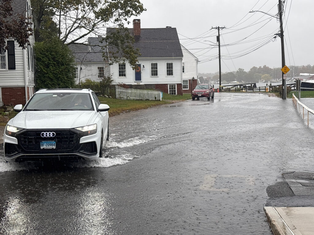 a car driving through a flooded street (MyCoast AI)