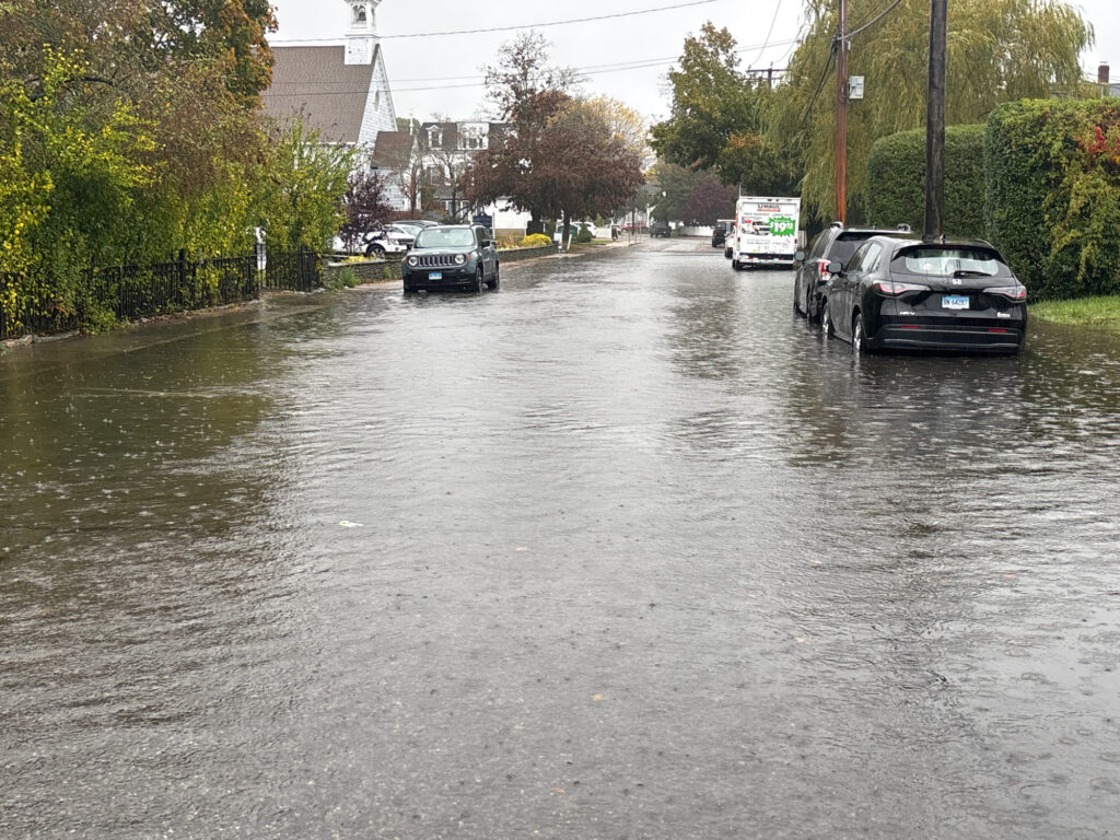 a flooded street with cars (MyCoast AI)