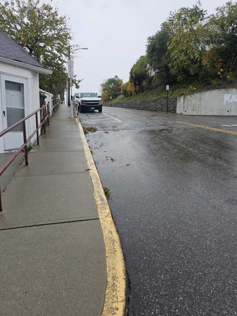 a road with a car parked on the side (MyCoast AI)