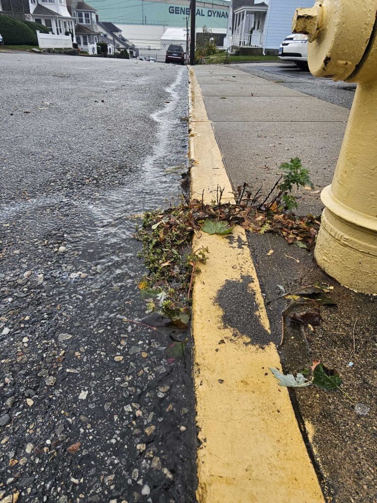 a road with a yellow pole and a road with a yellow pole (MyCoast AI)