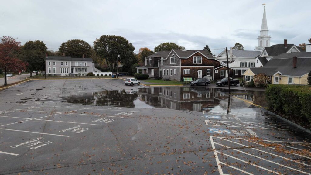 a flooded street with houses and cars (MyCoast AI)