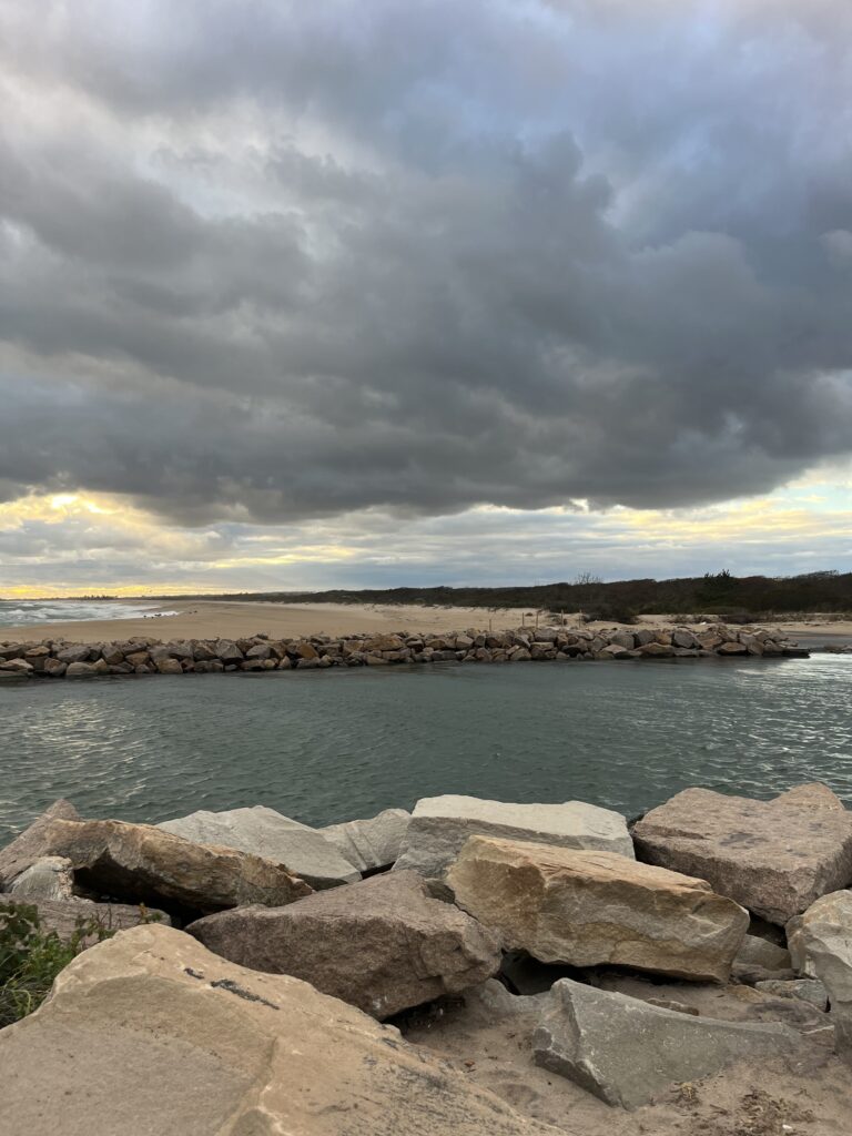 a rocky beach with a cloudy sky (MyCoast AI)