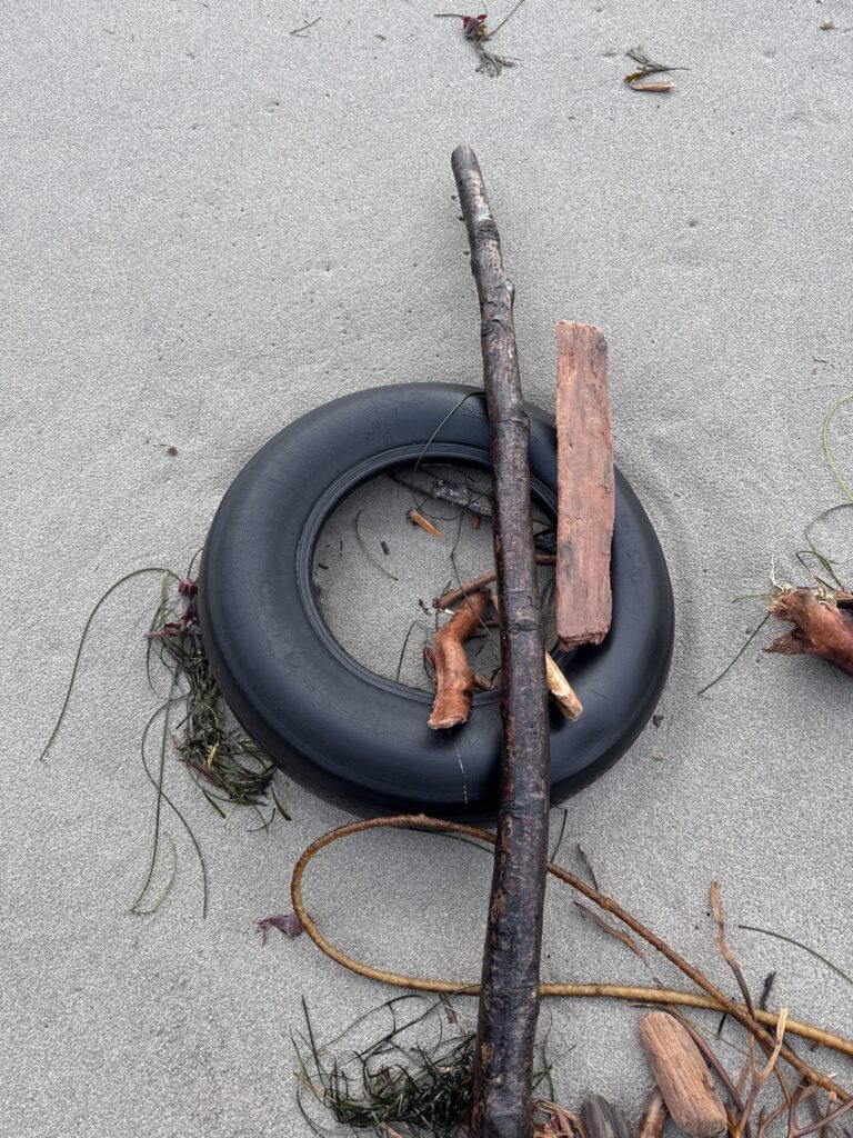 a black pipe with a black tube and a black tube with a brown substance on it (MyCoast AI)