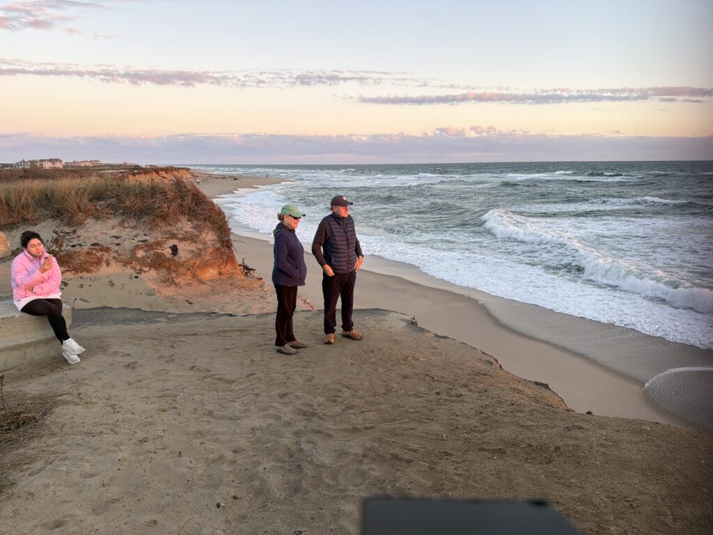 a group of people standing on a beach (MyCoast AI)