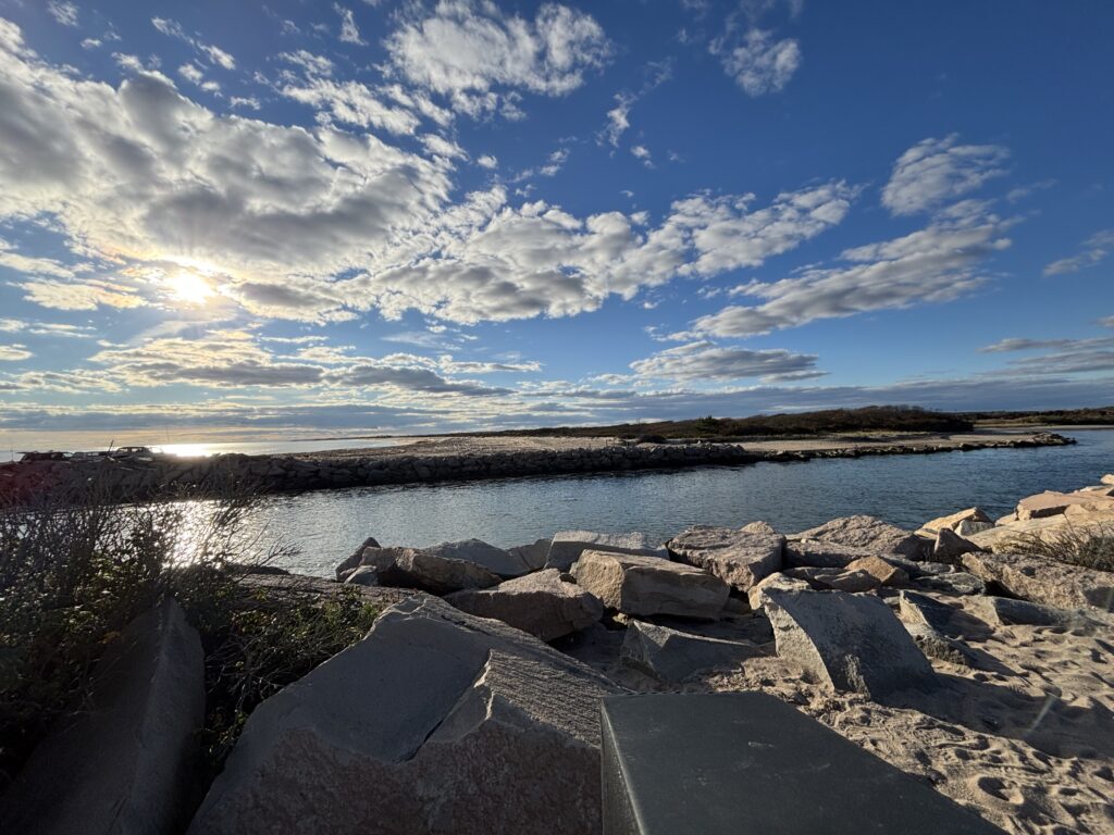 a rocky beach with a body of water in the background (MyCoast AI)