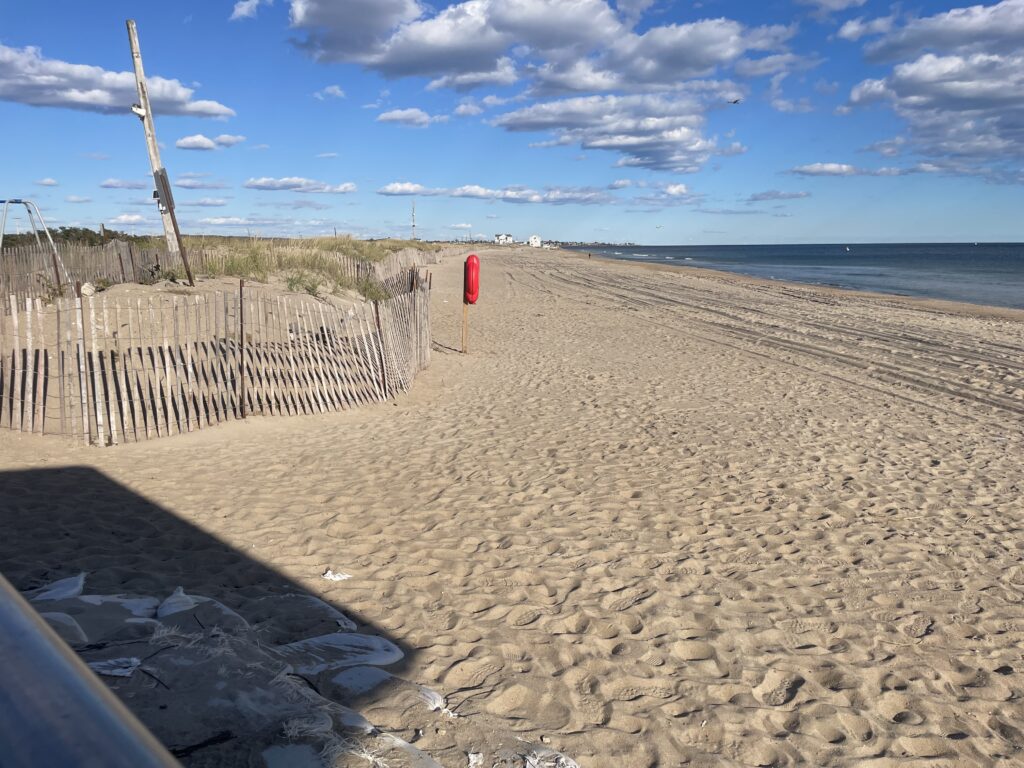 a sandy beach with a fence (MyCoast AI)