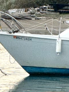 a boat tied to a dock (MyCoast AI)