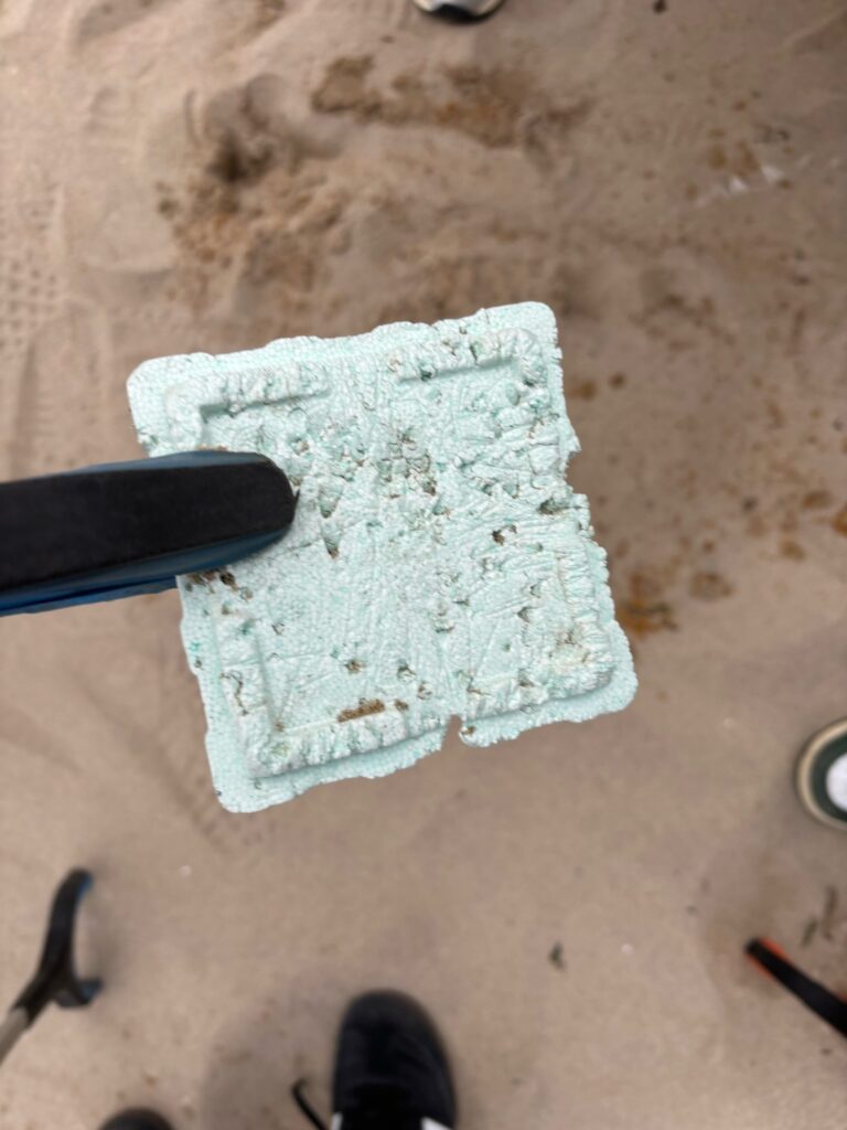 a white paper on the ground (MyCoast AI)