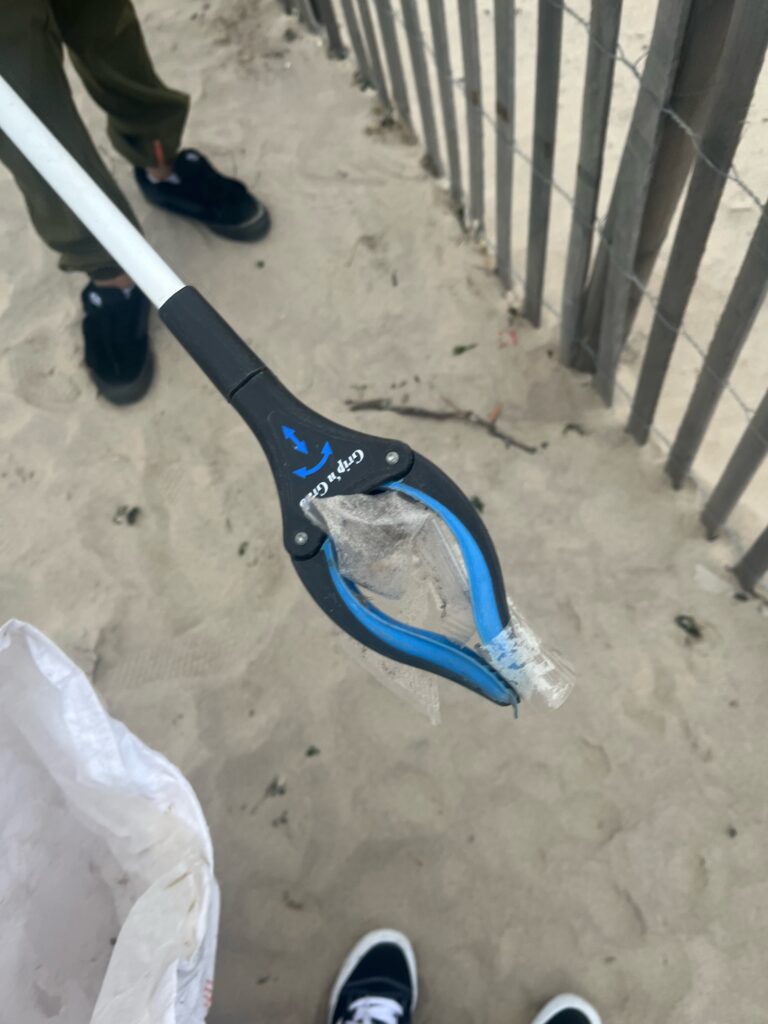 a person's leg with a blue and black shoe on it (MyCoast AI)