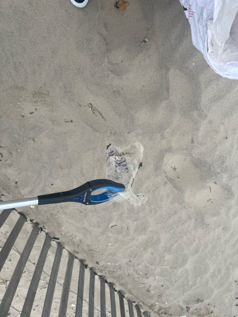 a blue plastic bag on the ground (MyCoast AI)