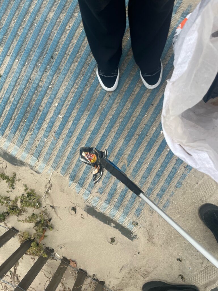 a person holding a fishing rod (MyCoast AI)