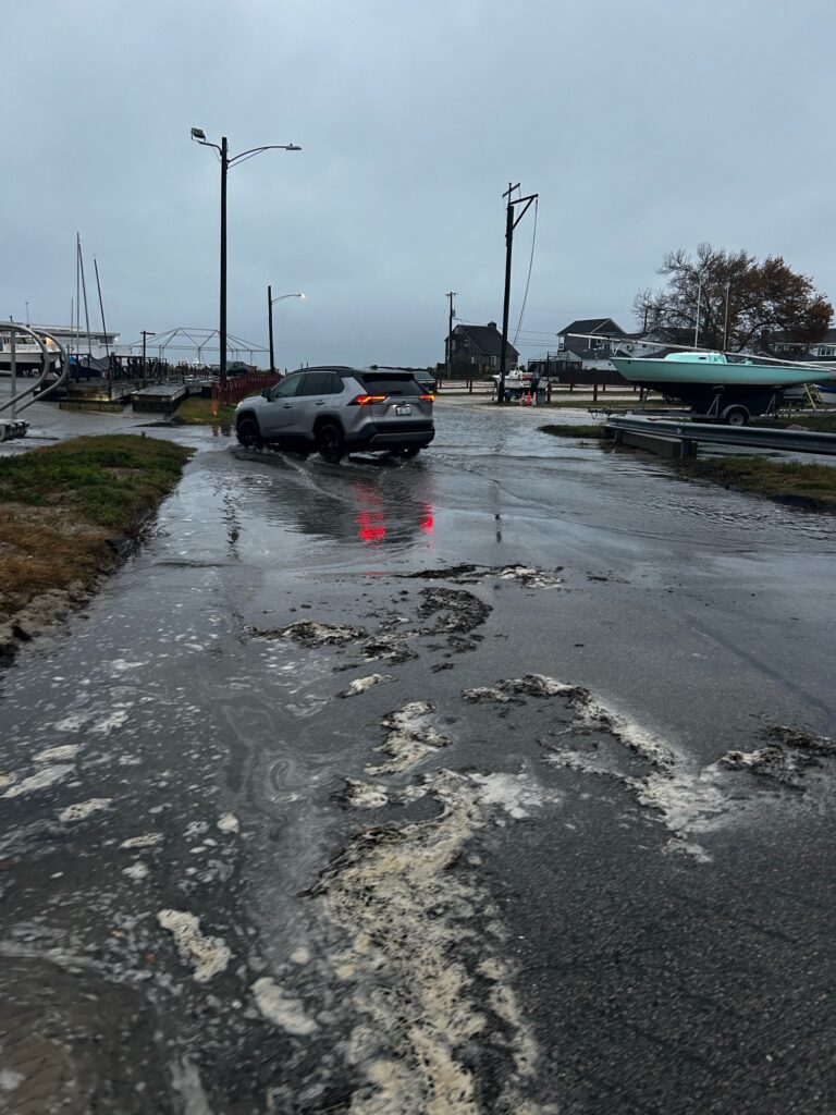 a car driving on a wet road (MyCoast AI)