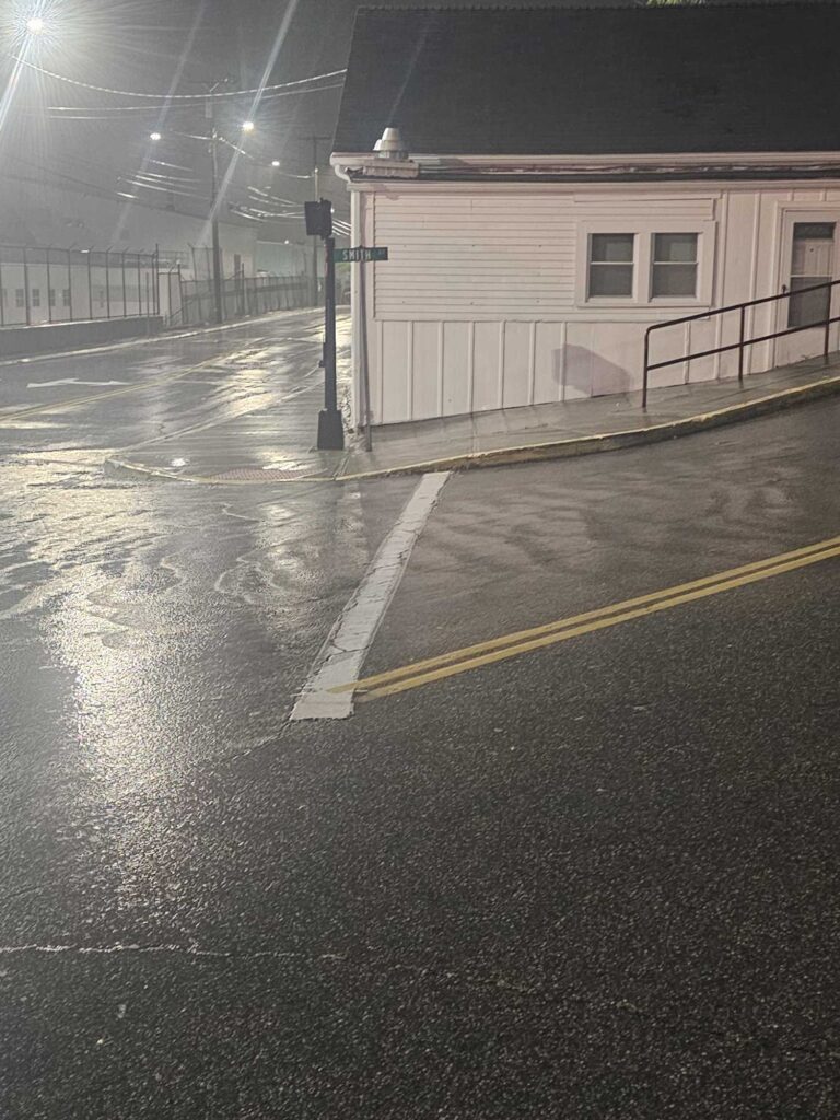 a building with a fence around it (MyCoast AI)