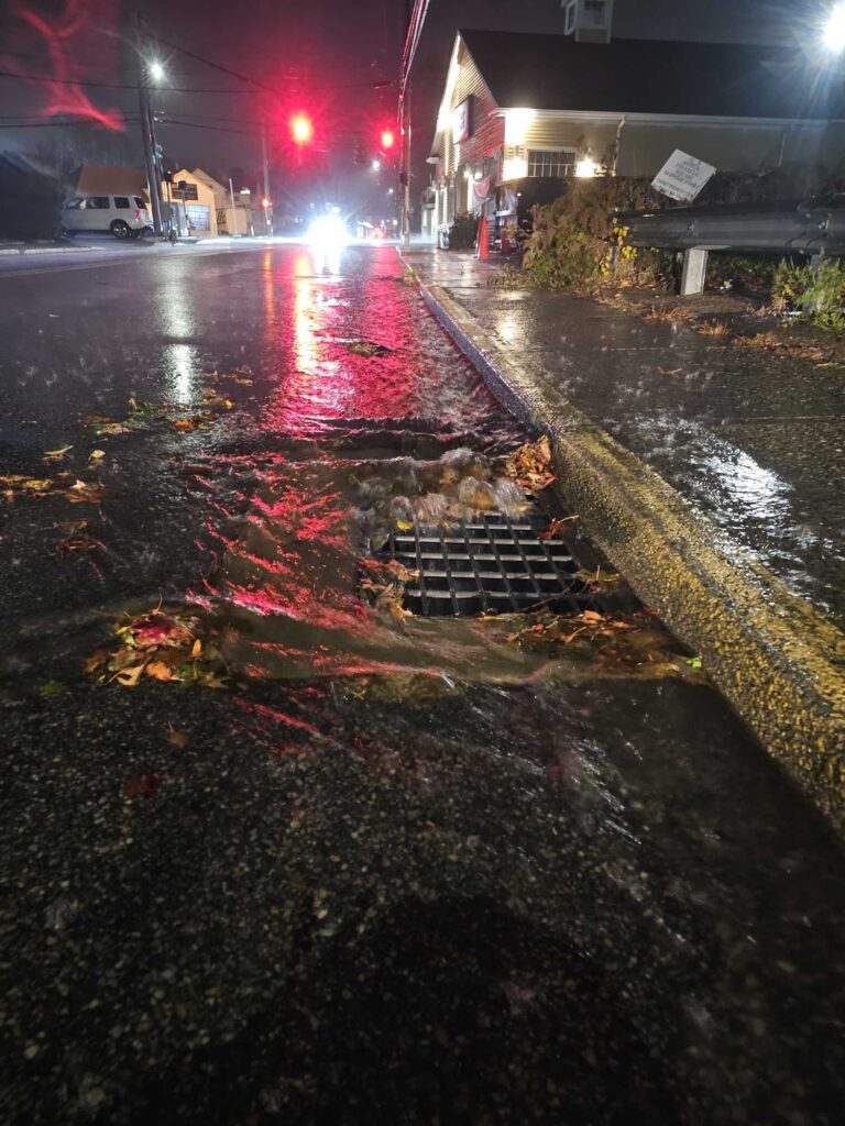 a sidewalk with a puddle of water (MyCoast AI)