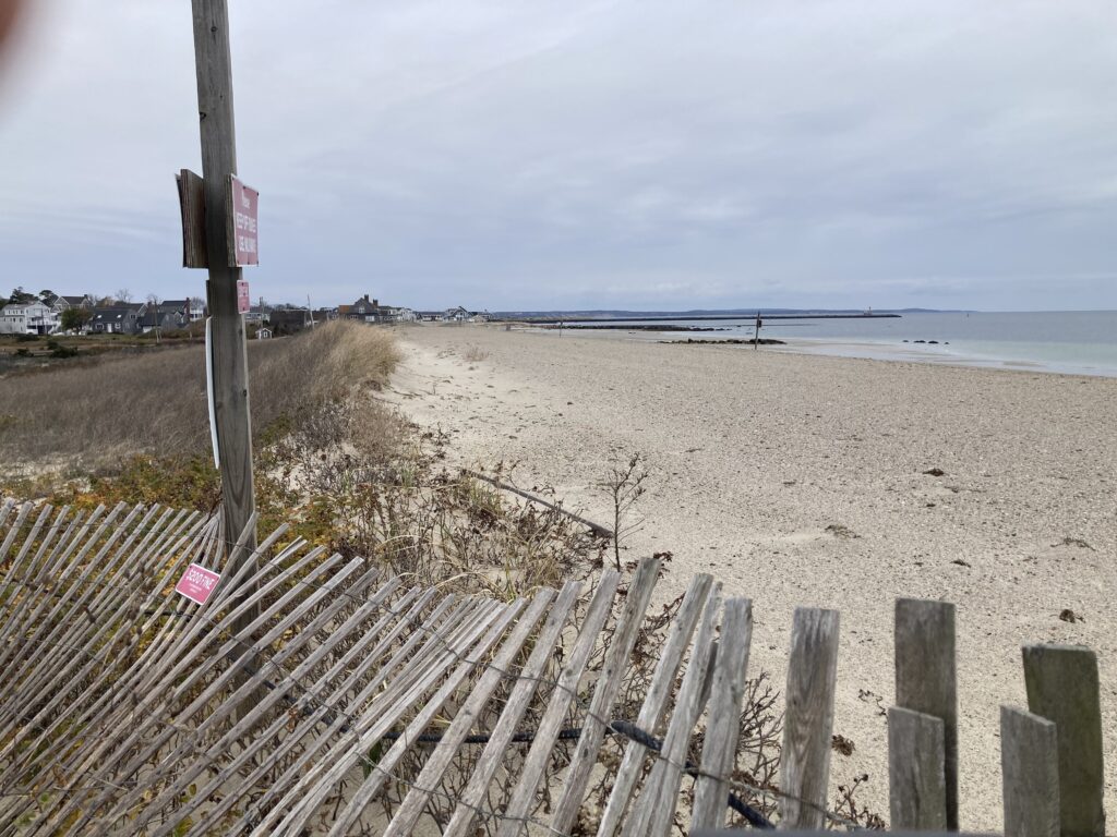 a wooden fence on a beach (MyCoast AI)