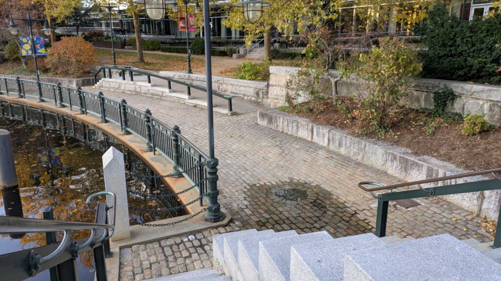 a walkway with railings and trees (MyCoast AI)
