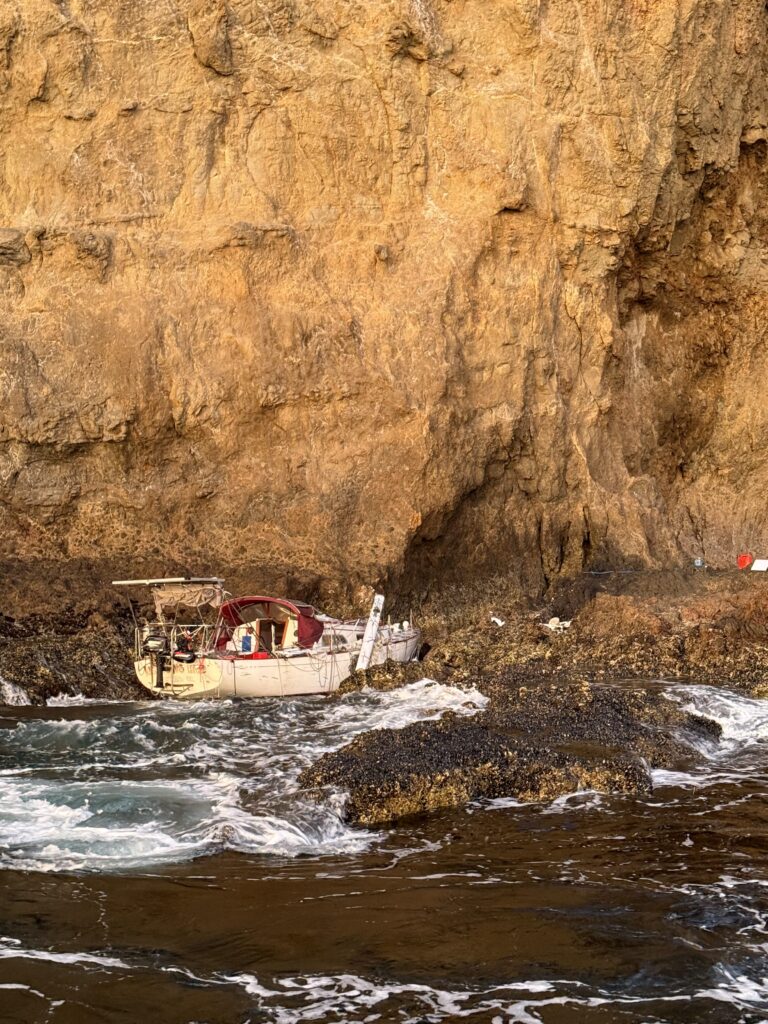 a boat going through a cave (MyCoast AI)