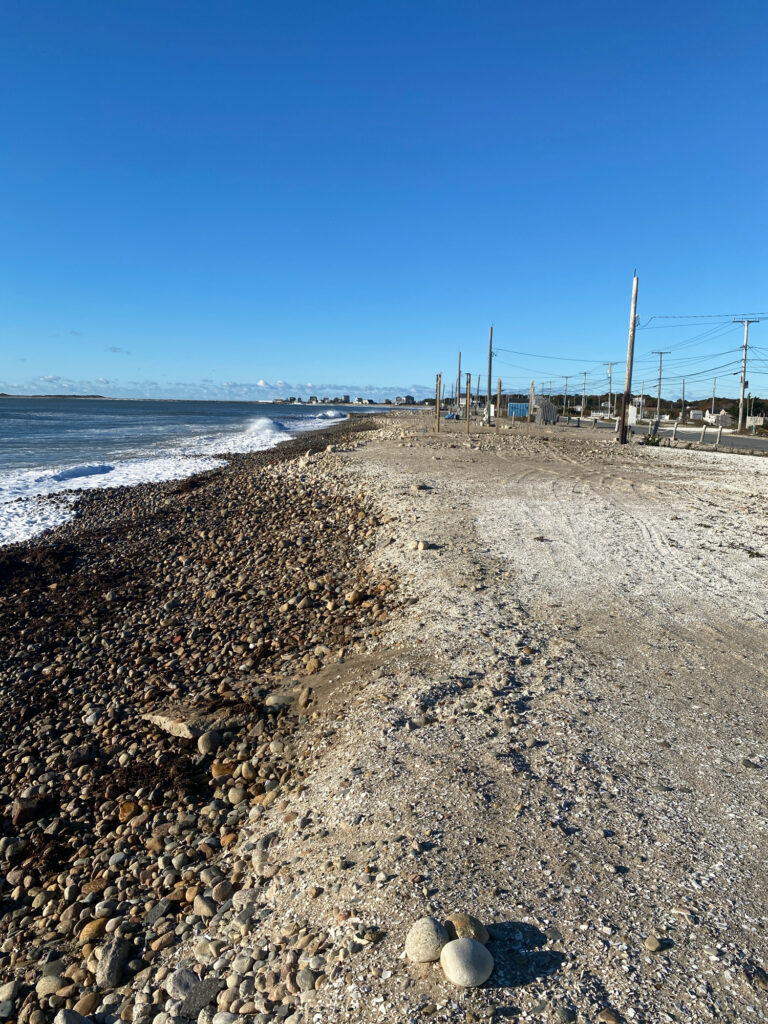 a rocky beach with water and blue sky (MyCoast AI)