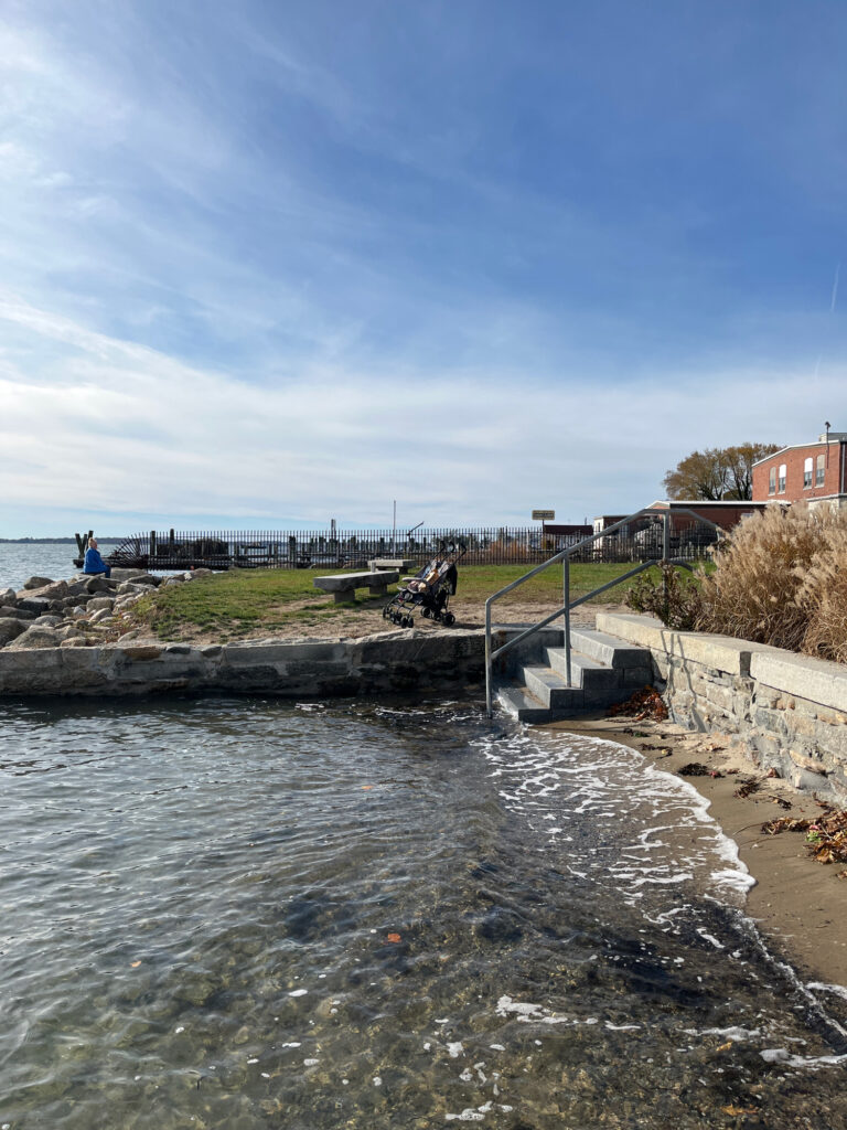 a body of water with a bridge and a walkway (MyCoast AI)