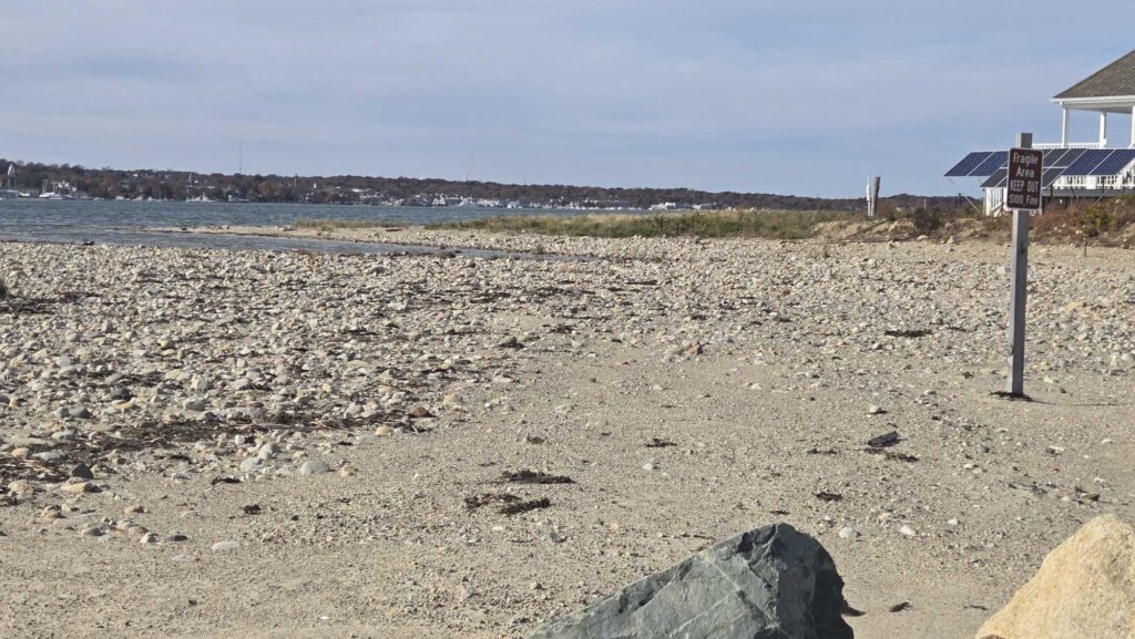 a rocky beach with a sign (MyCoast AI)
