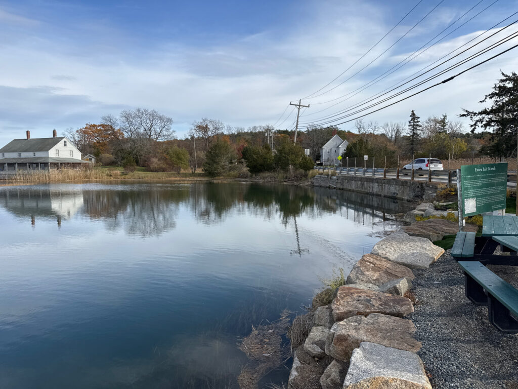 a body of water with rocks and a building in the background (MyCoast AI)