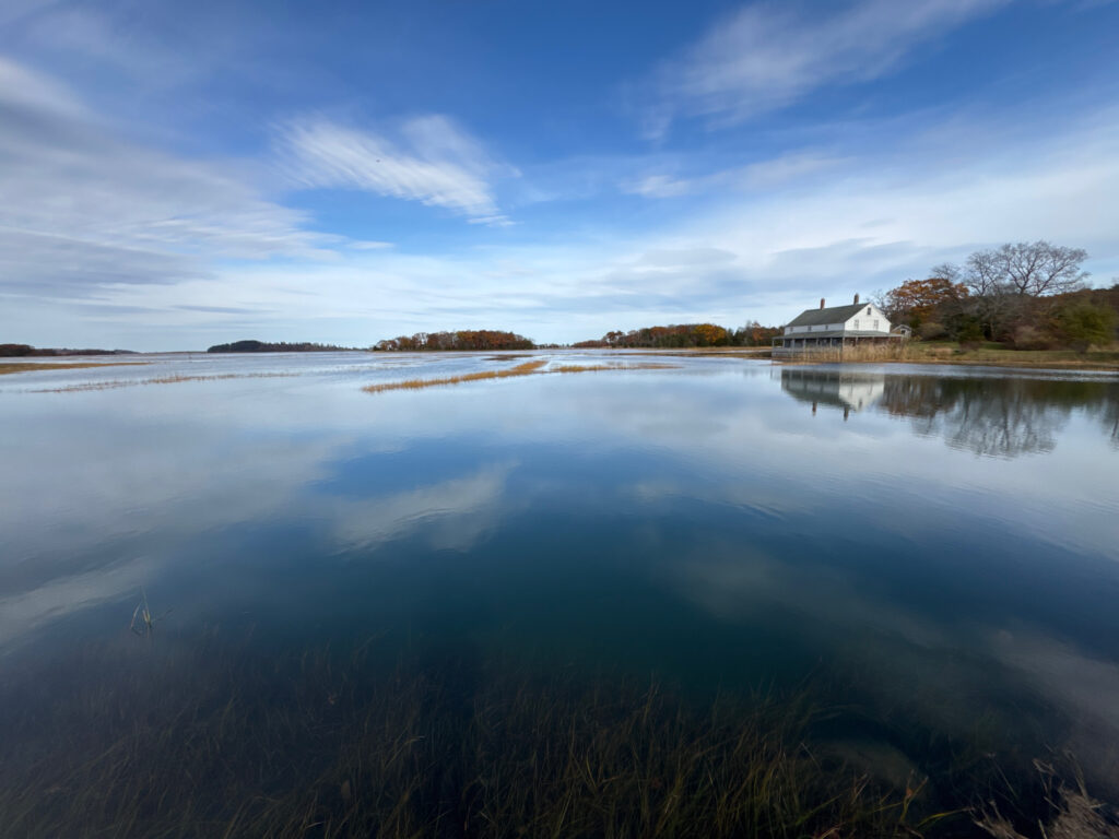 a body of water with a house in the background (MyCoast AI)