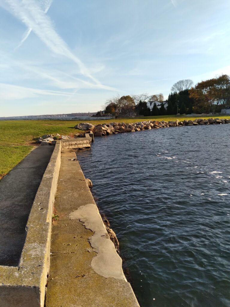 a body of water with grass and trees around it (MyCoast AI)