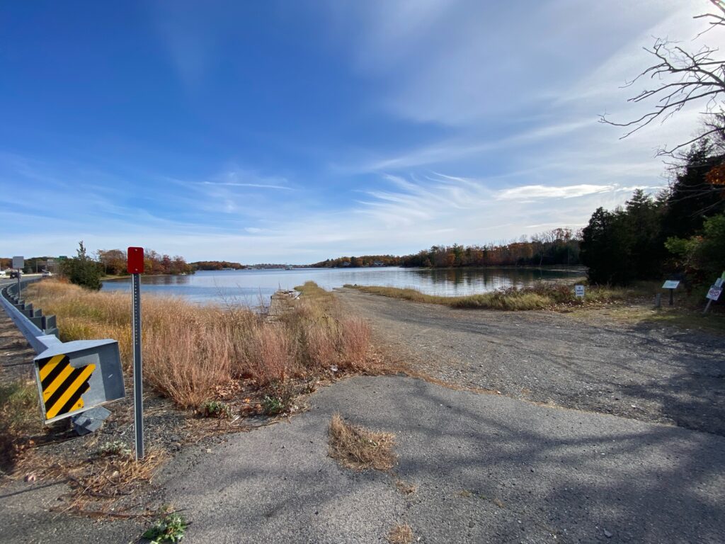 a road next to a body of water (MyCoast AI)