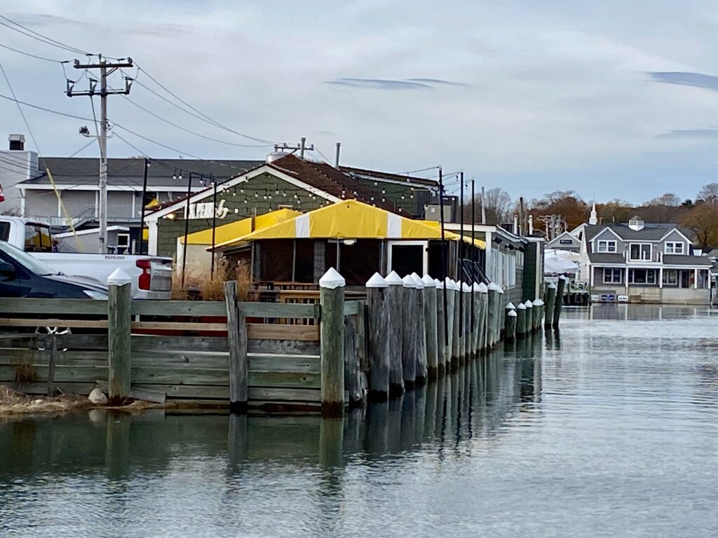 a dock with a yellow building on it (MyCoast AI)