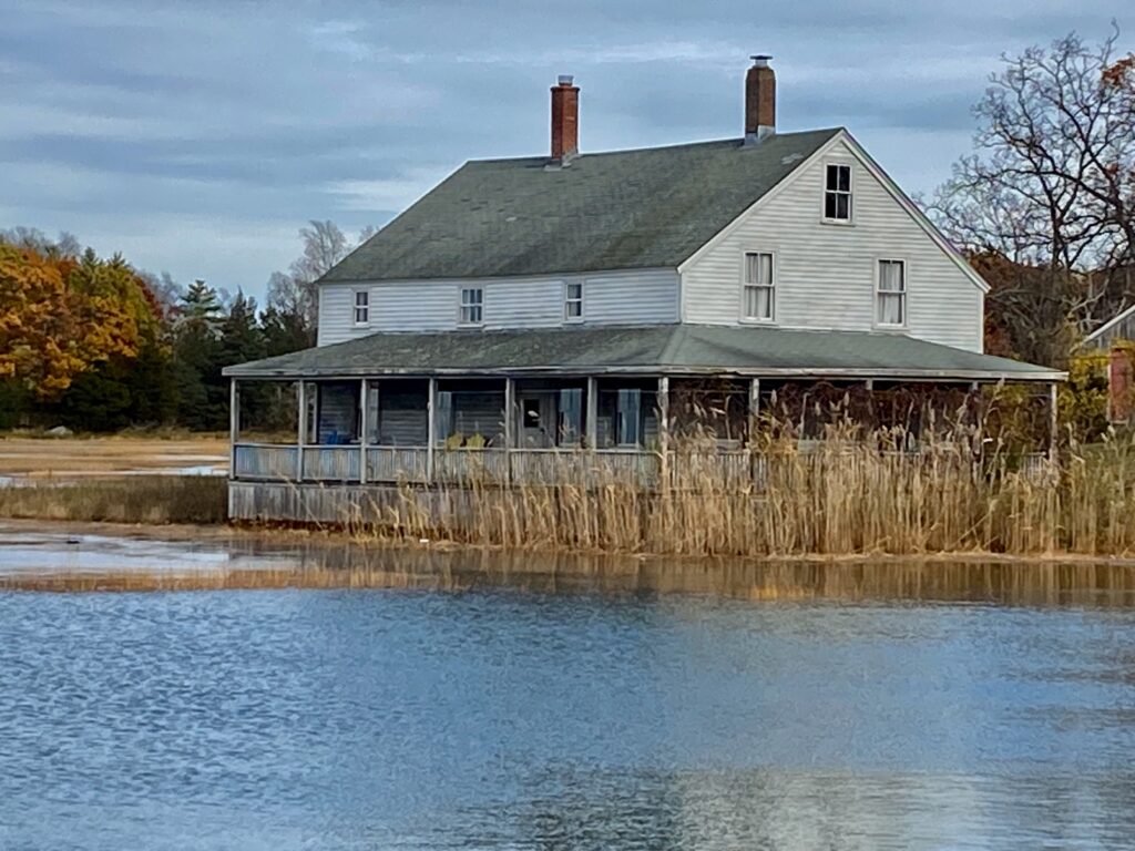 a house with a fence around it (MyCoast AI)