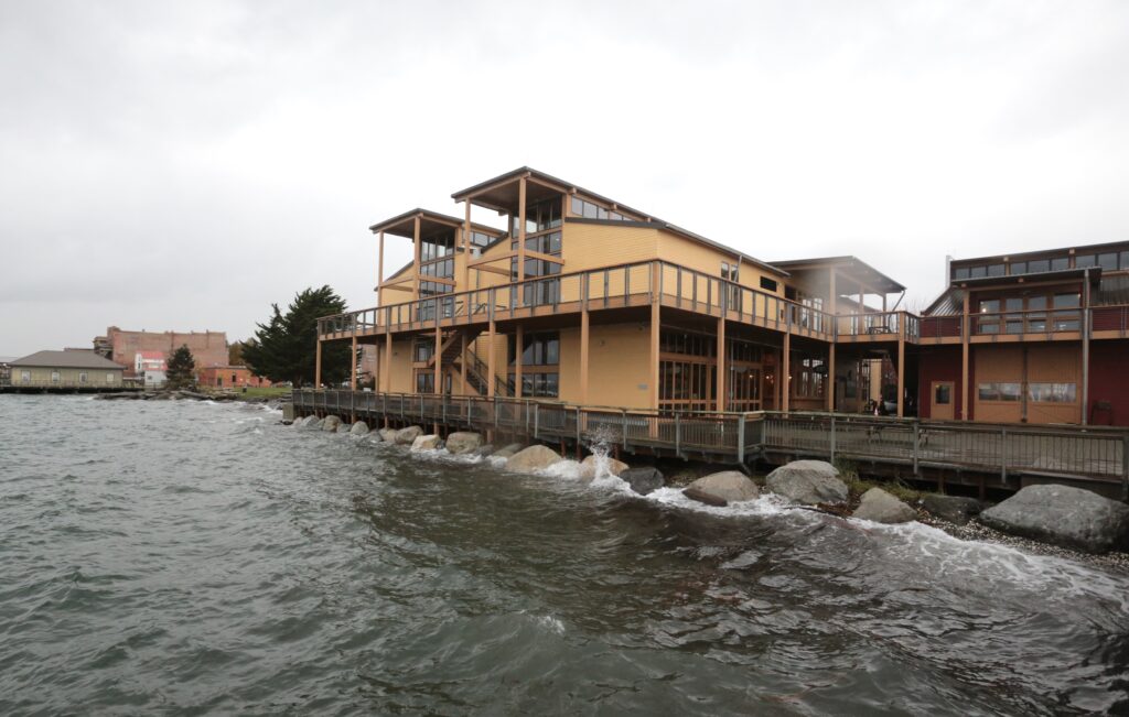 a building on a dock over water (MyCoast AI)