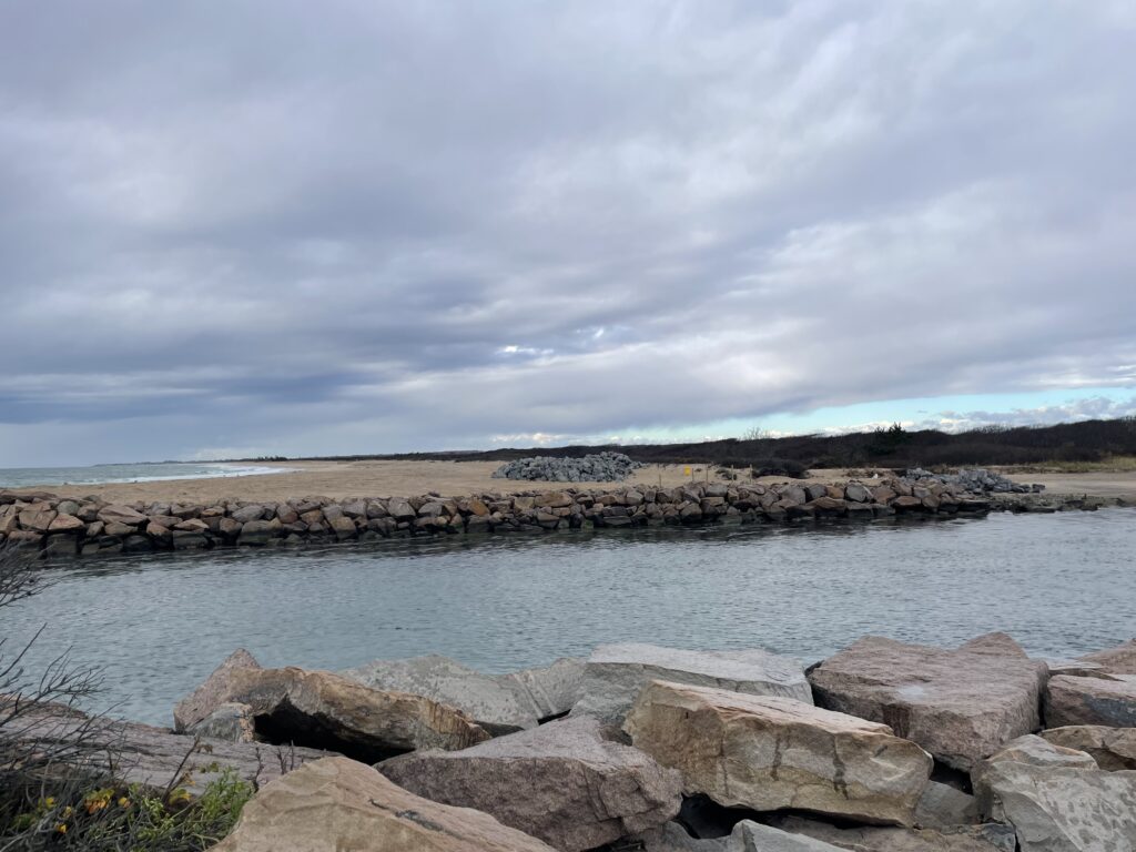 a rocky beach with a body of water in the background (MyCoast AI)