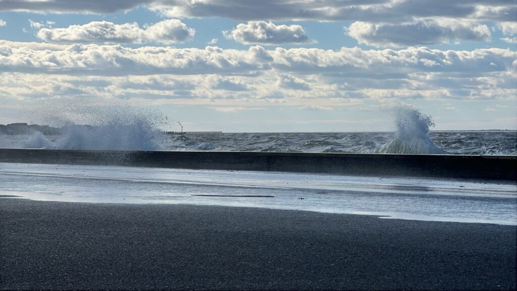 a beach with waves crashing (MyCoast AI)