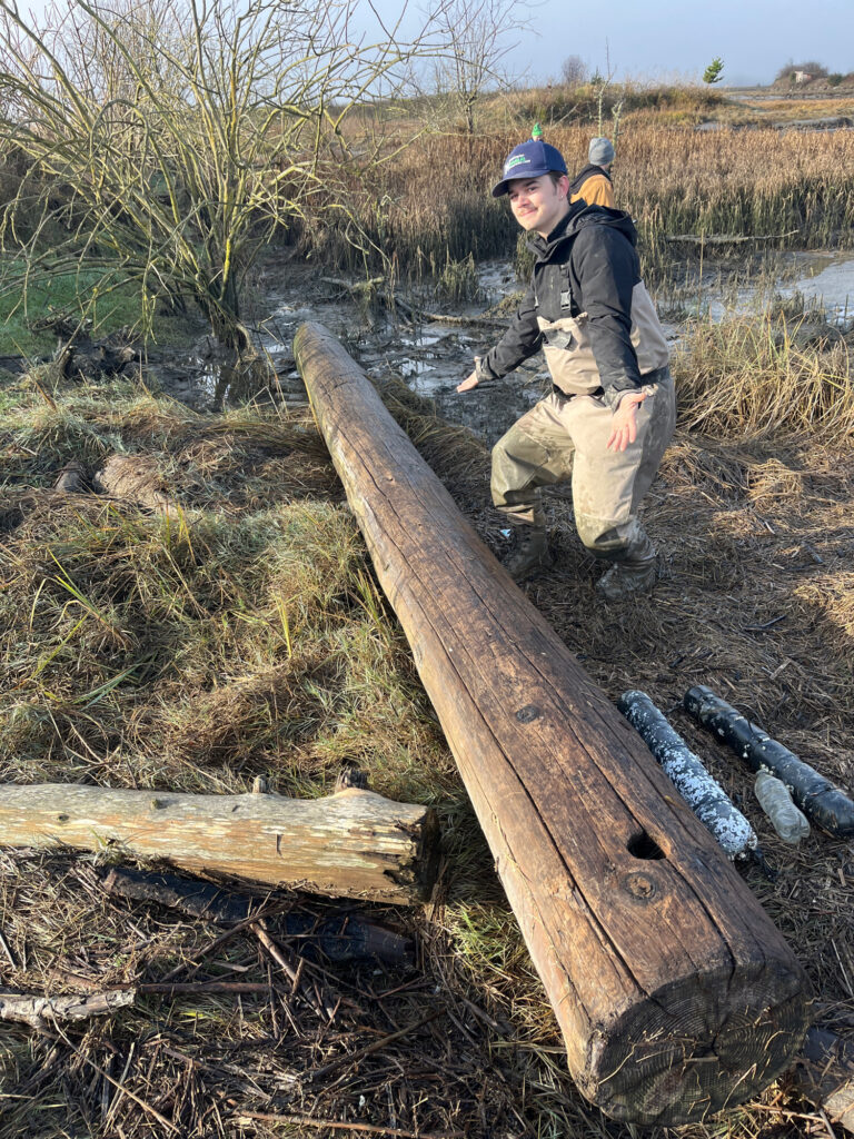 a man sitting on a log (MyCoast AI)