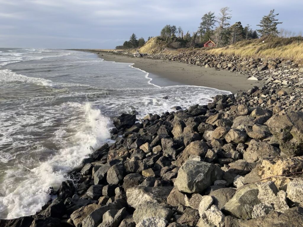 a rocky beach with waves crashing on it (MyCoast AI)