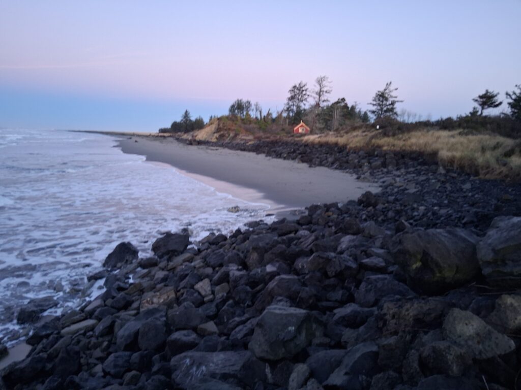 a rocky beach with a tent (MyCoast AI)