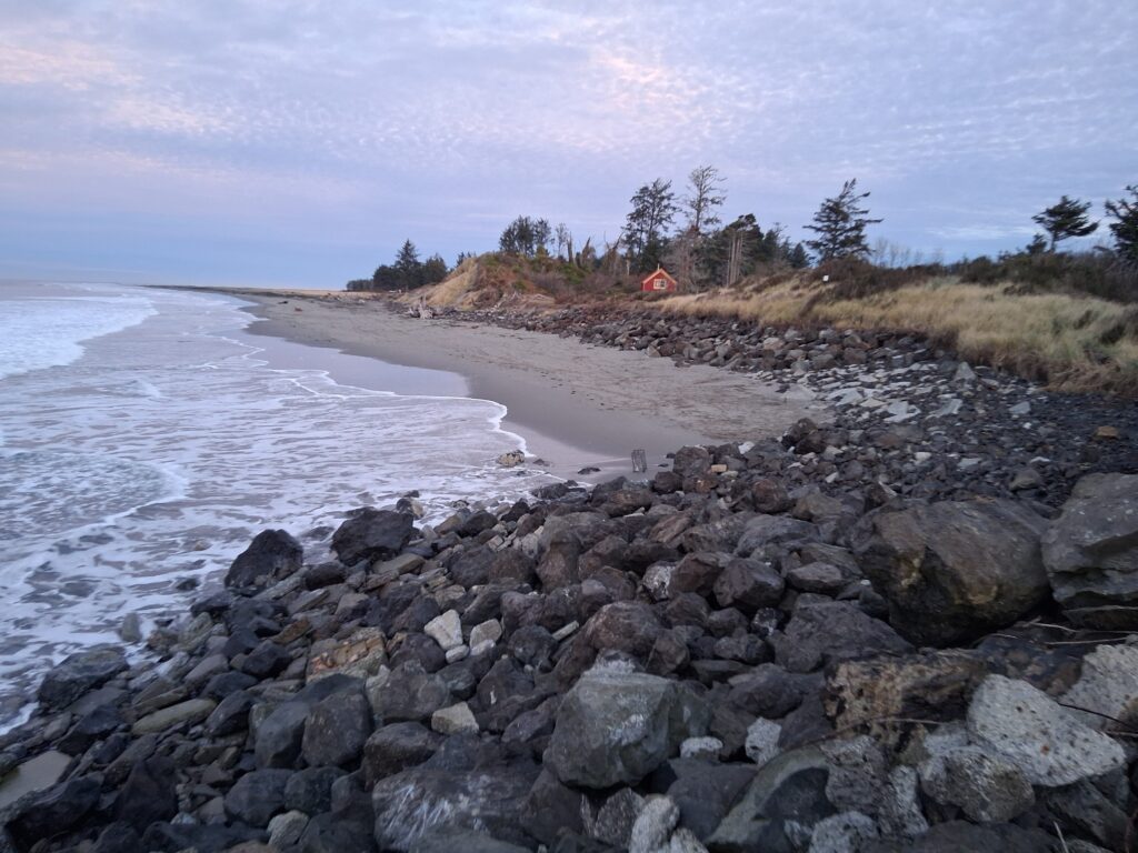a rocky beach with a tent (MyCoast AI)