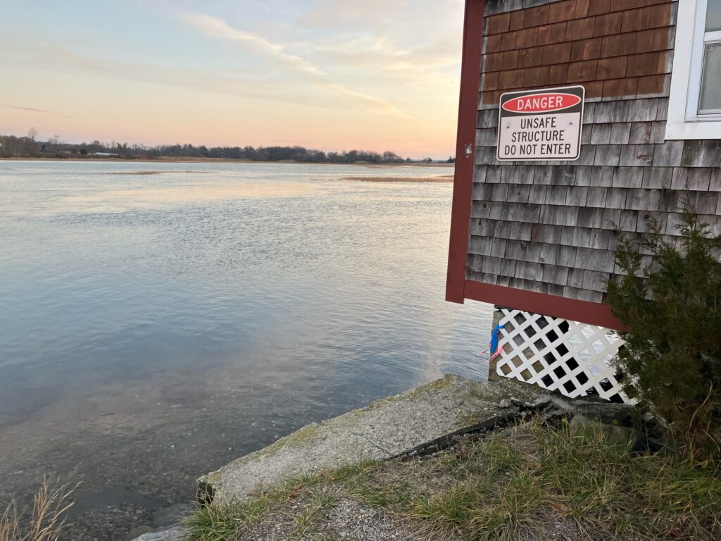 a building next to a body of water (MyCoast AI)