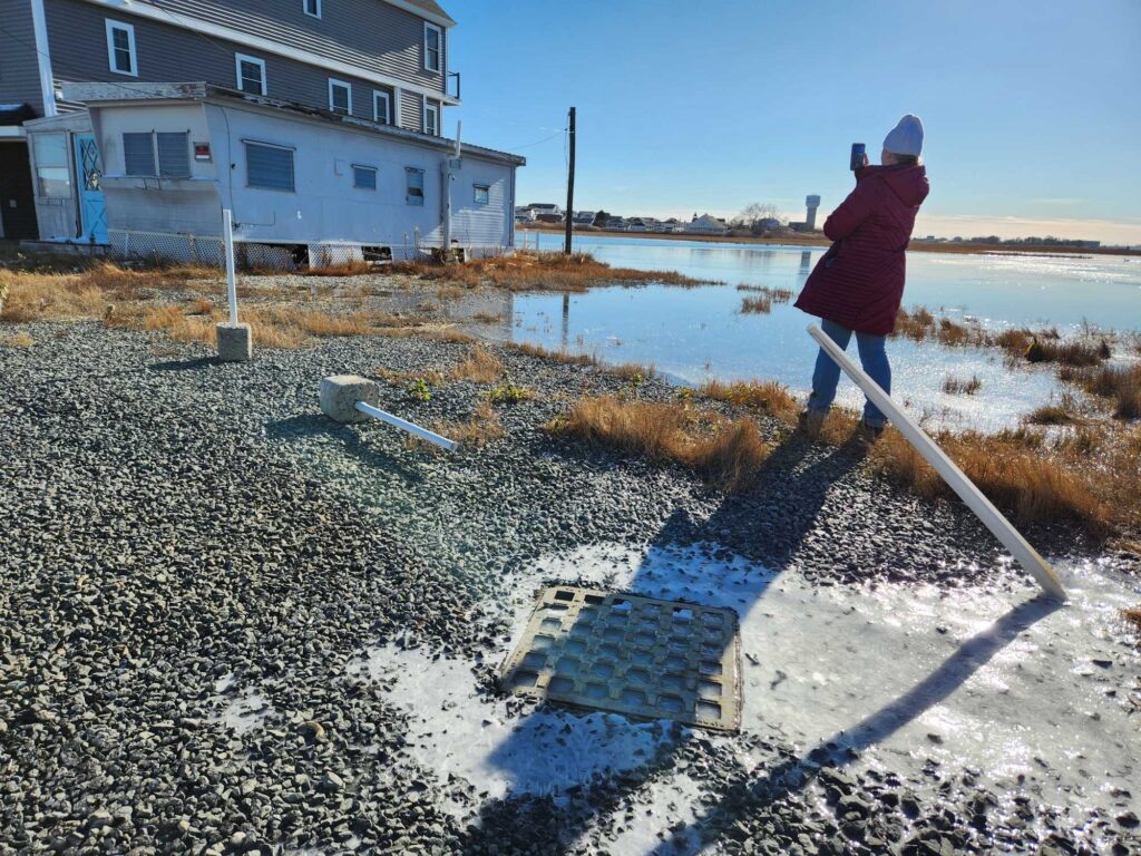a person shoveling snow (MyCoast AI)