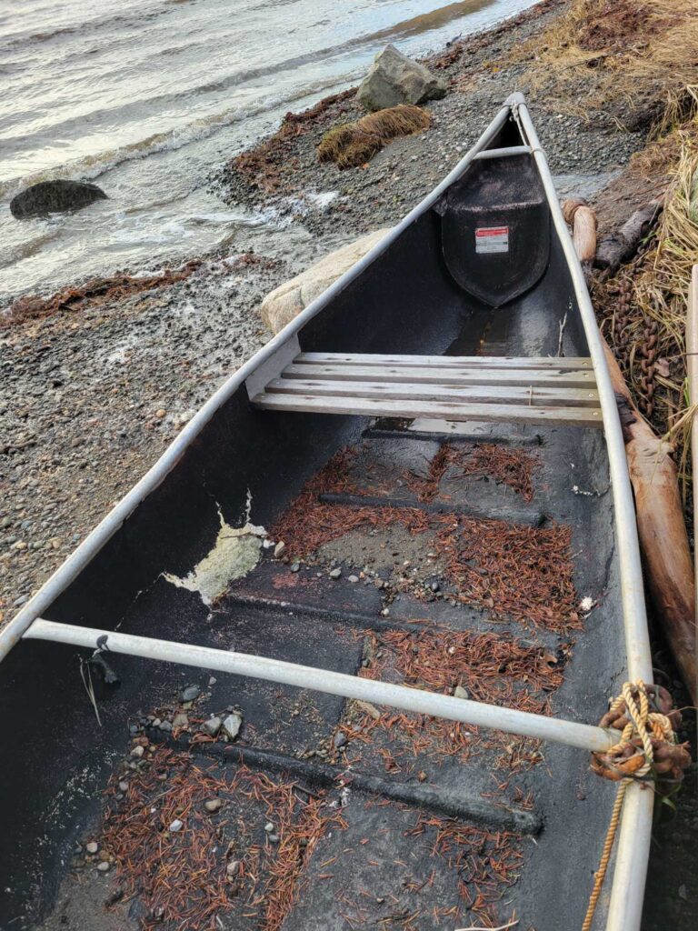 a broken down boat on the water (MyCoast AI)