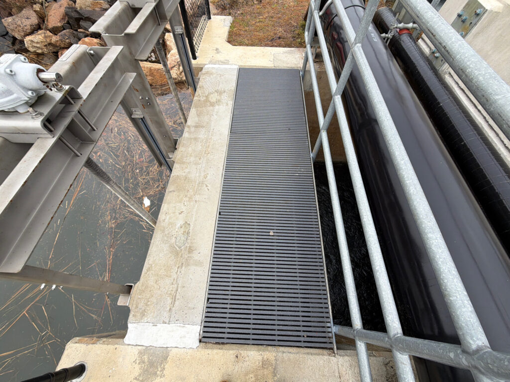 a metal staircase with a railing (MyCoast AI)