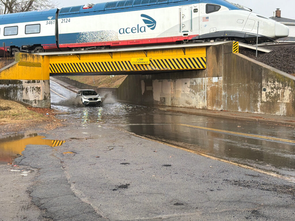 a car driving under a bridge (MyCoast AI)
