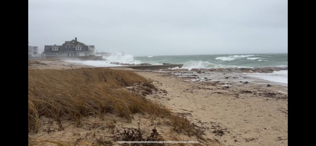 a beach with waves crashing on it (MyCoast AI)