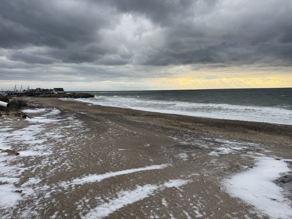 a beach with waves crashing on it (MyCoast AI)