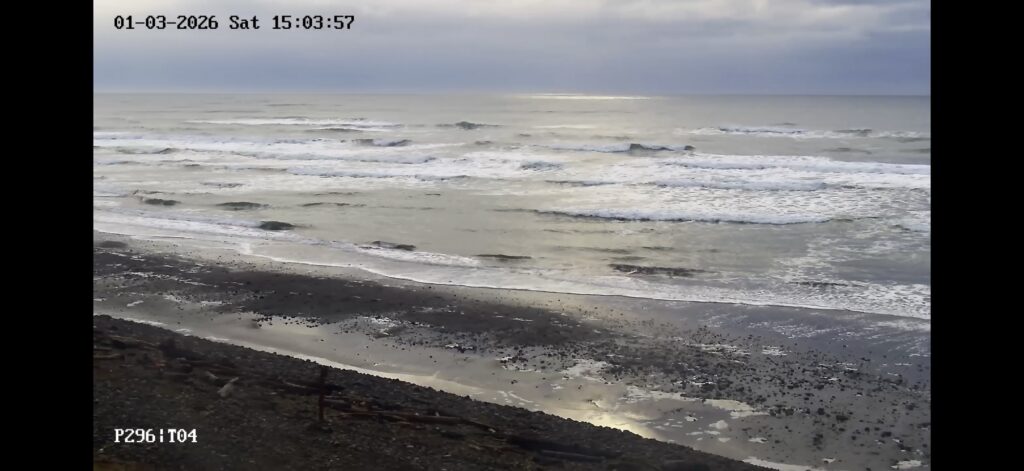 a beach with waves crashing (MyCoast AI)