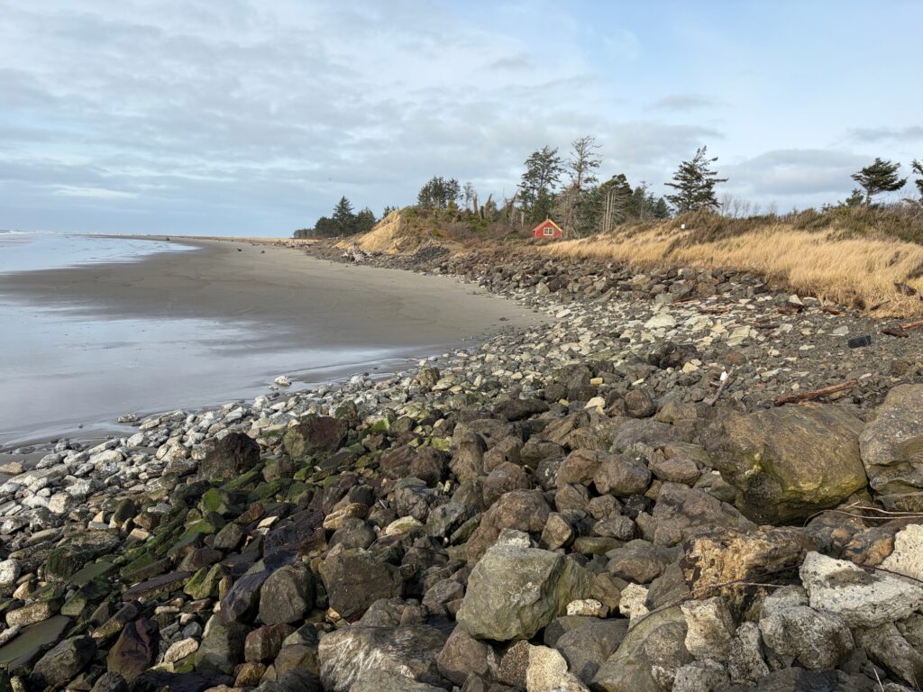a rocky beach with a tent (MyCoast AI)